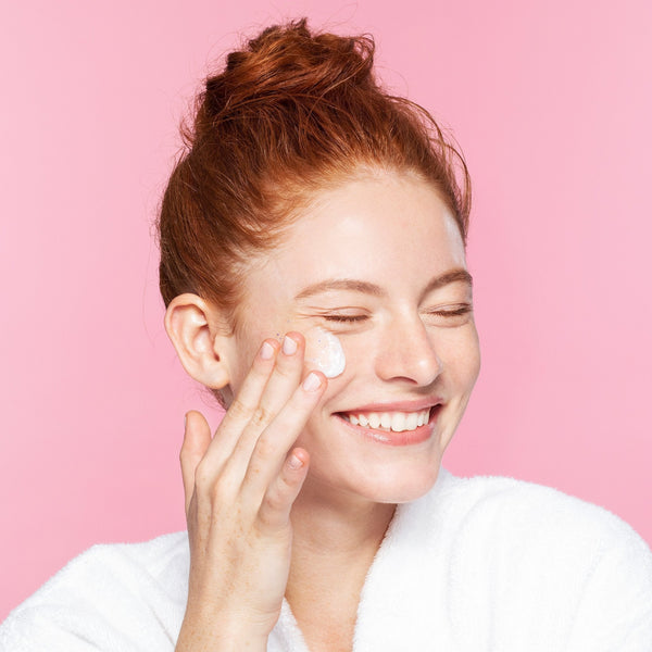 women rubbing rub-a-dub content on her face